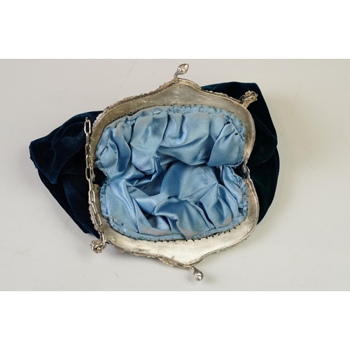 234 - A vintage velvet bag with white metal fastener marked .800 together with a antique silver caddy spoo... 