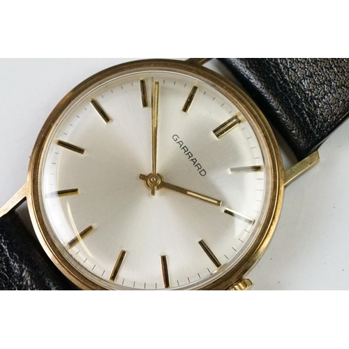 235A - A Gents 9ct gold cased Garrard wristwatch in original display case.