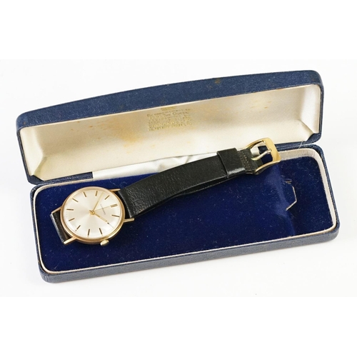 235A - A Gents 9ct gold cased Garrard wristwatch in original display case.