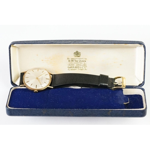 235A - A Gents 9ct gold cased Garrard wristwatch in original display case.