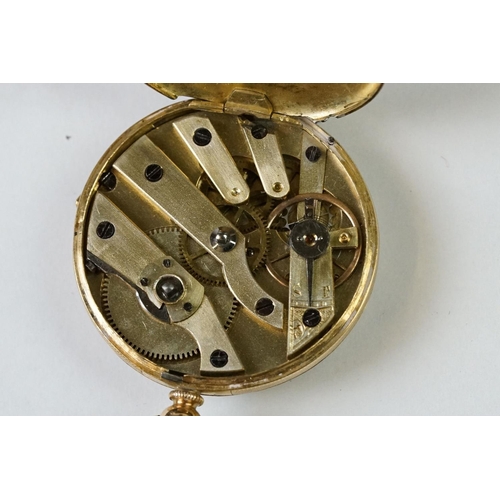 236 - A yellow metal cased fob watch with golden coloured dial and chain.