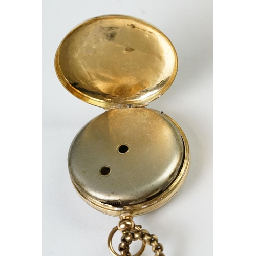 236 - A yellow metal cased fob watch with golden coloured dial and chain.