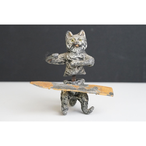 222 - A collection of five early 20th century cold painted spelter novelty cat figures together with a tab... 