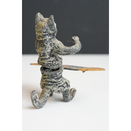 222 - A collection of five early 20th century cold painted spelter novelty cat figures together with a tab... 