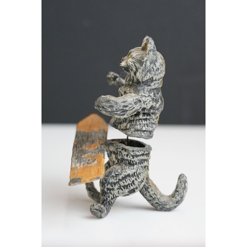 222 - A collection of five early 20th century cold painted spelter novelty cat figures together with a tab... 