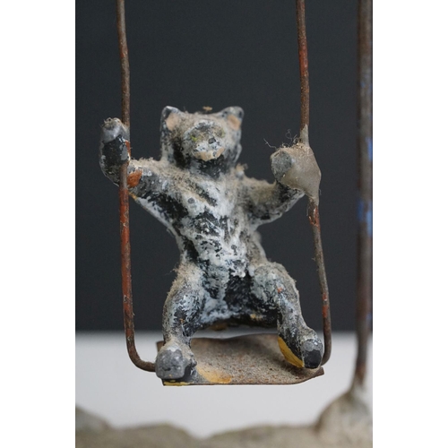 222 - A collection of five early 20th century cold painted spelter novelty cat figures together with a tab... 