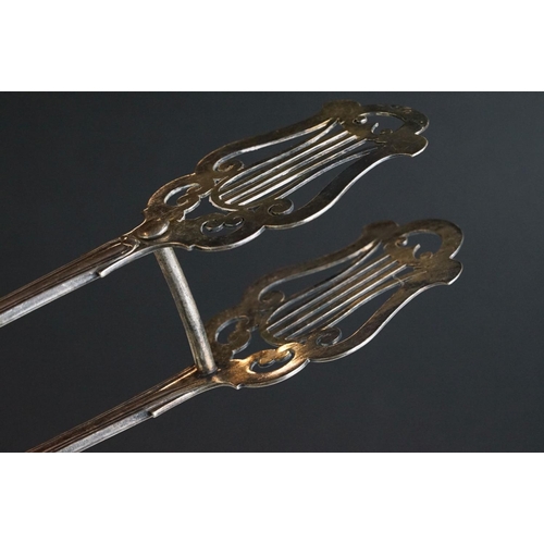 246 - Pair of silver plated meat skewers in the form of swords, a set of plated cake tongs & a soup ladle ... 