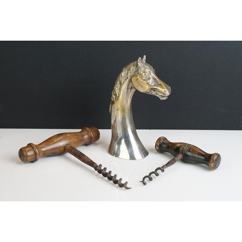 247 - Two antique wooden handled corkscrews together with a bottle opener in the form of a horse.