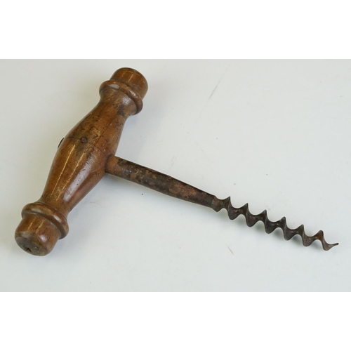 247 - Two antique wooden handled corkscrews together with a bottle opener in the form of a horse.