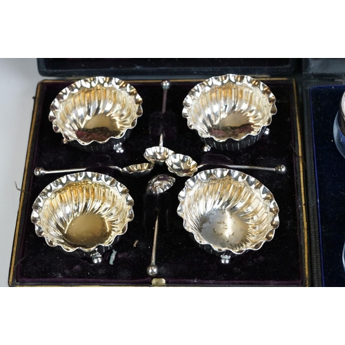 250 - Cased set of four silver gilt salt cellars & spoons, Birmingham 1897 and a cased set of four silver ... 