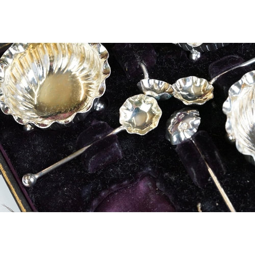 250 - Cased set of four silver gilt salt cellars & spoons, Birmingham 1897 and a cased set of four silver ... 