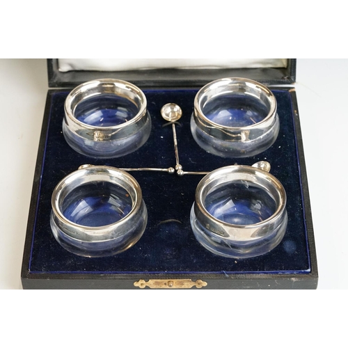 250 - Cased set of four silver gilt salt cellars & spoons, Birmingham 1897 and a cased set of four silver ... 