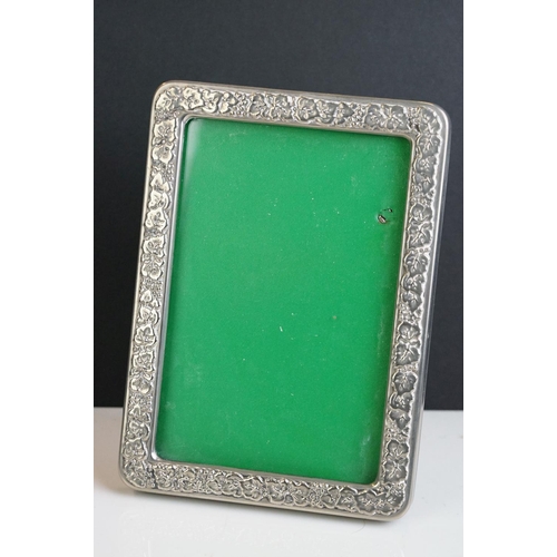 256 - A fully hallmarked sterling silver fronted photograph frame together with two others.