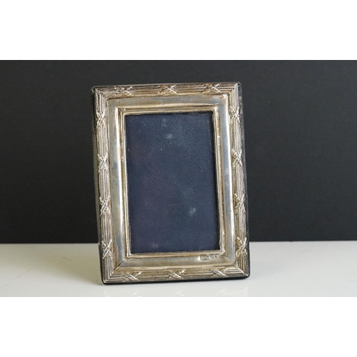 256 - A fully hallmarked sterling silver fronted photograph frame together with two others.