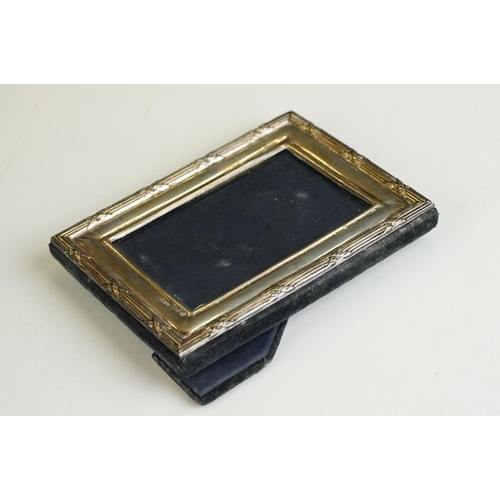 256 - A fully hallmarked sterling silver fronted photograph frame together with two others.