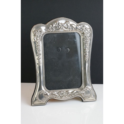 256 - A fully hallmarked sterling silver fronted photograph frame together with two others.