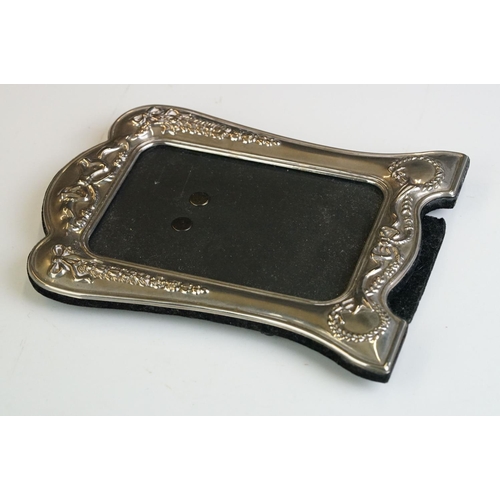 256 - A fully hallmarked sterling silver fronted photograph frame together with two others.