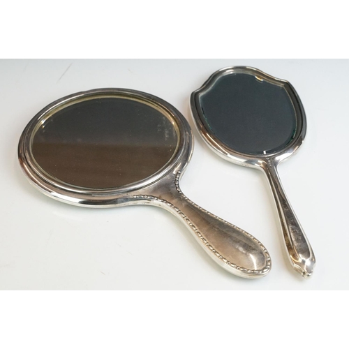 257 - Two fully hallmarked sterling silver hand mirrors, both with engine turned decoration.