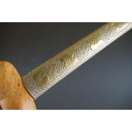 258 - A 19th/20th Century Malaysian Kris Dagger with typical hand-forged wavy blade.  It comes complete wi... 