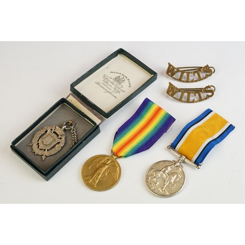 263 - A British World War One full size medal pair to include the Victory medal and the 1914-1918 British ... 