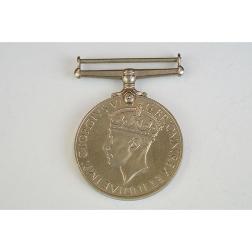 264 - A British World War Two full size medal group of three to include the 1939-45 War Medal, the 1939-45... 