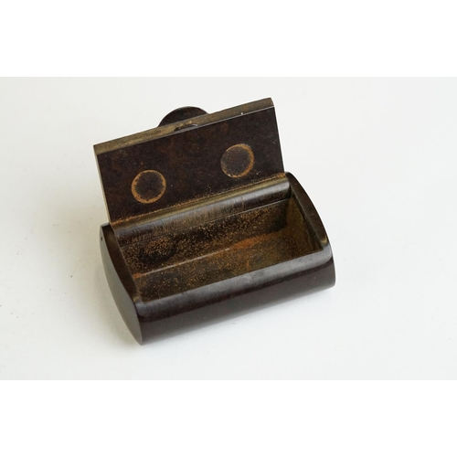 267 - An early 20th century bakelite pocket snuff box together with a antique general improvement medal an... 