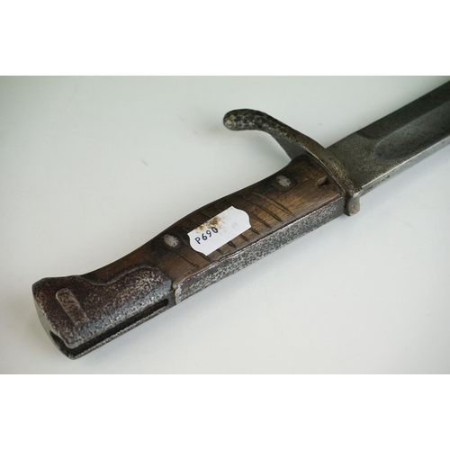 268 - A German World War One Butchers bayonet complete with scabbard, the blade marked E & F HORSTER SOLIN... 