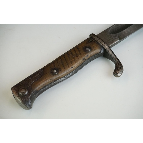 268 - A German World War One Butchers bayonet complete with scabbard, the blade marked E & F HORSTER SOLIN... 