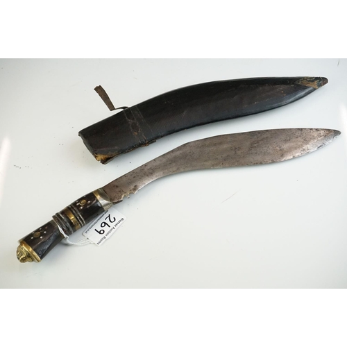 269 - Two vintage Indian Kukri knives, the smaller with brass trim and the large with white metal, both co... 