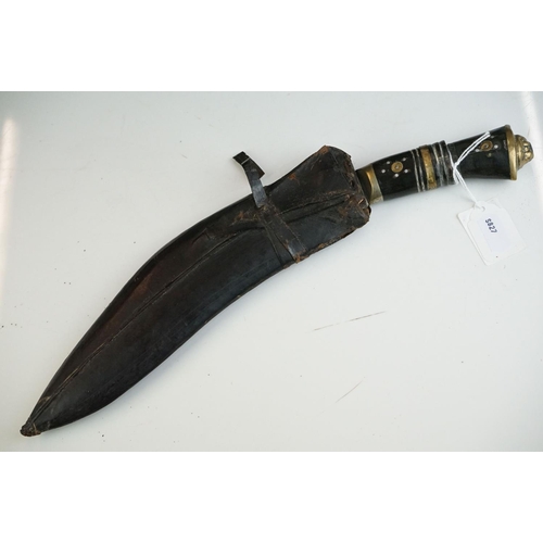 269 - Two vintage Indian Kukri knives, the smaller with brass trim and the large with white metal, both co... 