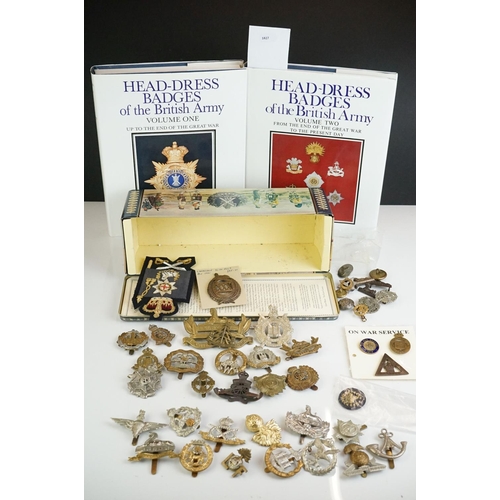 273 - A group of military collectables to include Head Dress Badges of the British Army books in two volum... 