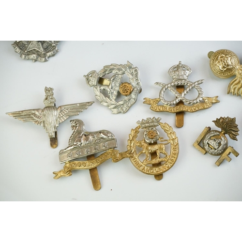 273 - A group of military collectables to include Head Dress Badges of the British Army books in two volum... 