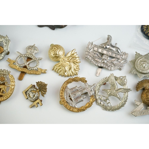 273 - A group of military collectables to include Head Dress Badges of the British Army books in two volum... 