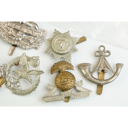 273 - A group of military collectables to include Head Dress Badges of the British Army books in two volum... 