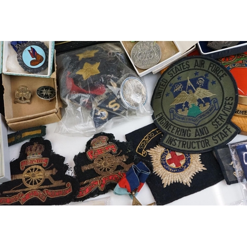 274 - A group of military collectables to include a framed set of Royal Army Ordnance corps badges, a sele... 