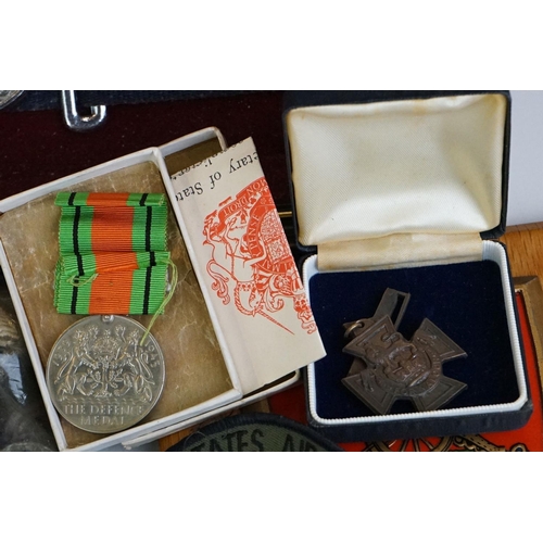 274 - A group of military collectables to include a framed set of Royal Army Ordnance corps badges, a sele... 