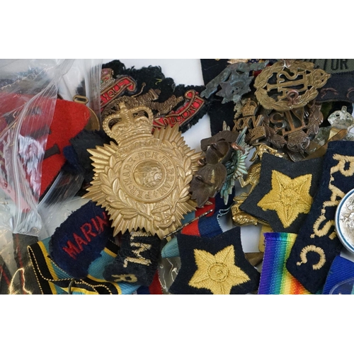 274 - A group of military collectables to include a framed set of Royal Army Ordnance corps badges, a sele... 