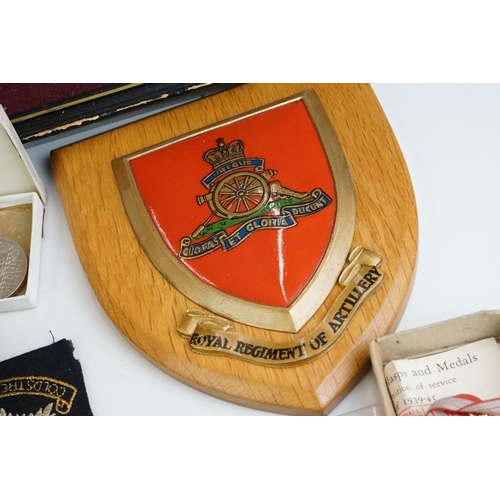 274 - A group of military collectables to include a framed set of Royal Army Ordnance corps badges, a sele... 