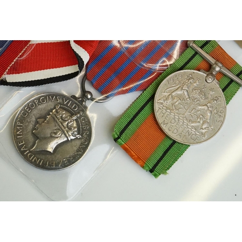 274 - A group of military collectables to include a framed set of Royal Army Ordnance corps badges, a sele... 