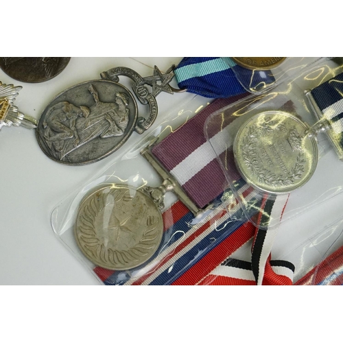 274 - A group of military collectables to include a framed set of Royal Army Ordnance corps badges, a sele... 