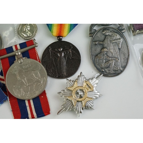 274 - A group of military collectables to include a framed set of Royal Army Ordnance corps badges, a sele... 