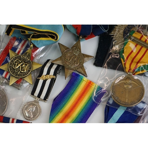 274 - A group of military collectables to include a framed set of Royal Army Ordnance corps badges, a sele... 