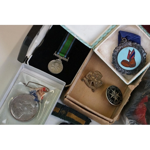 274 - A group of military collectables to include a framed set of Royal Army Ordnance corps badges, a sele... 