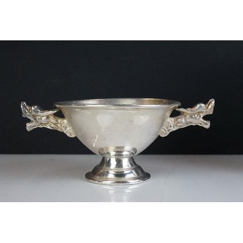 288 - A set of eight white metal Chinese finger bowls with dragon handles.