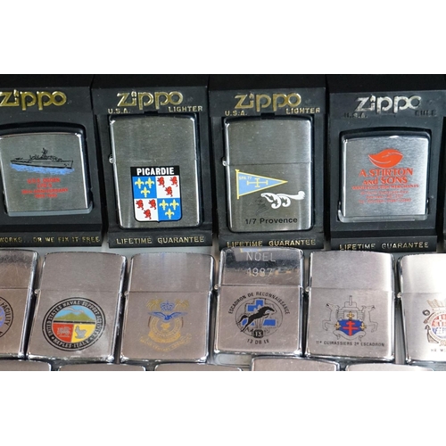 289 - A large collection of approx sixty Zippo lighters to include military and advertising examples, toge... 