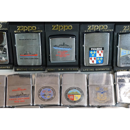 289 - A large collection of approx sixty Zippo lighters to include military and advertising examples, toge... 