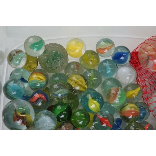 299 - A small collection of mixed marbles.