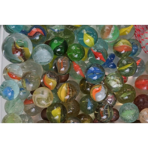 299 - A small collection of mixed marbles.