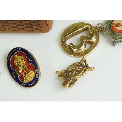 304 - Collection of pocket watch fobs, enamel badges & yellow metal charms