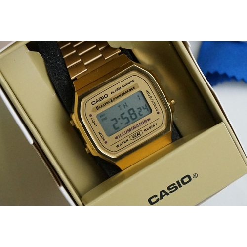 311 - A collection of gents and ladies fashion watches all within original boxes to include Casio and Gues... 